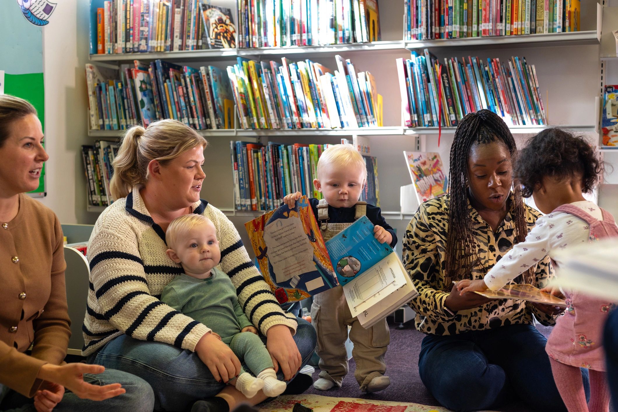 Children exploring books together in a welcoming learning space